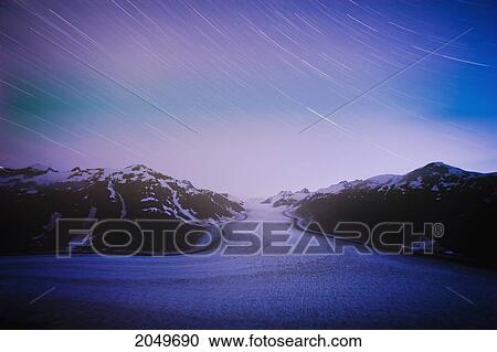 Stock Image - Salmon Glacier And Star Trails, Northern British Columbia. Fotosearch
