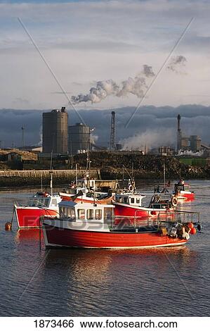 Stock Photograph - Saltburn, Teesside, England; Boats Moored In The Water And An Industrial Area In The Background. Fotosearch