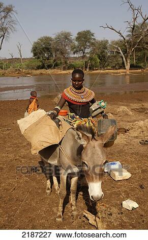 Stock Photo - Samburu Collecting River Water&#Xa; Sasaab Kenya. Fotosearch