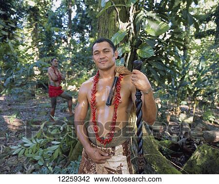 Stock Image - Samoan in traditional dress with staff; Upolu Island, Samoa. Fotosearch