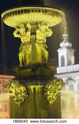 Samson's Fountain And Town Hall At Night; Cesky Krumlov, Czech Republic View Large Photo Image Stock Image - Samson's Fountain And Town Hall At Night; Cesky Krumlov, Czech Republic. Fotosearch