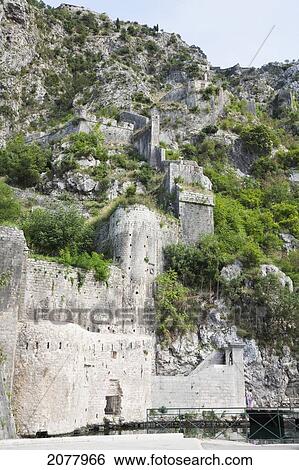San Giovanni Fortress Surrounds The Town Of Kotor. The Walls Surrounding The Town Are 5 Kilometers Long And Can Be Up To Twenty Meters Tall., Monte View Large Photo Image Stock Photograph - San Giovanni Fortress Surrounds The Town Of Kotor. The Walls Surrounding The Town Are 5 Kilometers Long And Can Be Up To Twenty Meters Tall., Monte. Fotosearch