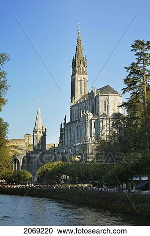 Stock Image - Sanctuary Of Our Lady Of Lourdes And The Gave De Pau River; Lourdes Hautes-Pyrenees France. Fotosearch