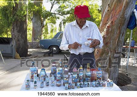 Stock Image - Sand bottle artist, Mendoza, Argentina. Fotosearch