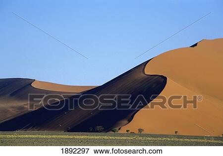 Stock Photo - Sand Dune Against Clear Sky In Namib-Naukluft National Park. Fotosearch