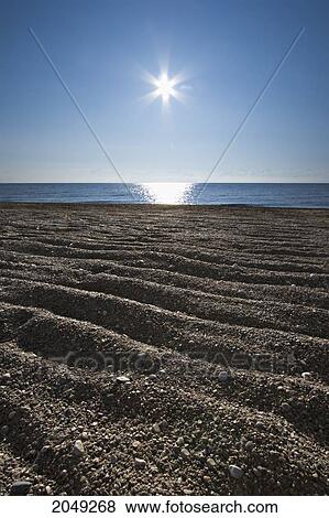 Stock Photo - Sand Ripples On The Beach At Sunrise, Lake Winnipeg, Gimli, Manitoba. Fotosearch