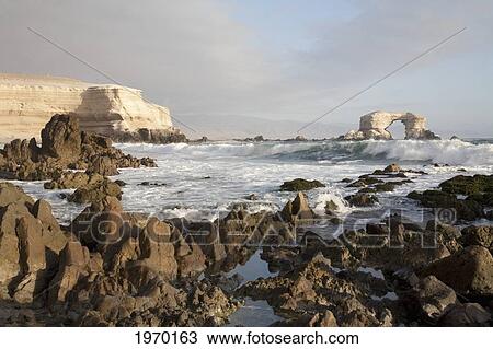 Sandstone Cliffs And The Natural Monument Of La Portada De Antofagasta, Antofagasta Region, Chile View Large Photo Image Stock Image - Sandstone Cliffs And The Natural Monument Of La Portada De Antofagasta, Antofagasta Region, Chile. Fotosearch