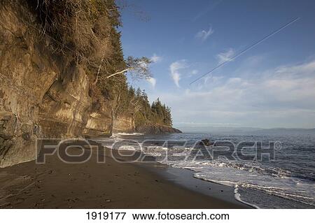Sandstone Cliffs On The Juan De Fuca Marine Trail; Mystic Beach, Vancouver Island, British Columbia, Canada View Large Photo Image Stock Photo - Sandstone Cliffs On The Juan De Fuca Marine Trail; Mystic Beach, Vancouver Island, British Columbia, Canada. Fotosearch
