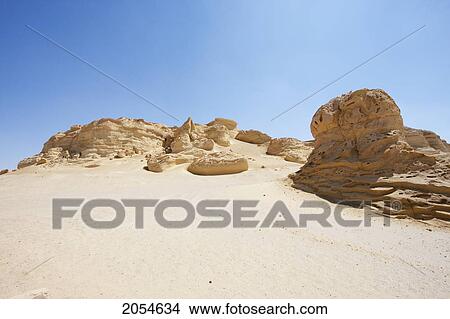 Sandstone Formations Resulting From Wind Erosion In Wadi Al-Hitan (Whale Valley), El Fayoum, Egypt View Large Photo Image Picture - Sandstone Formations Resulting From Wind Erosion In Wadi Al-Hitan (Whale Valley), El Fayoum, Egypt. Fotosearch