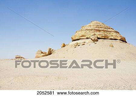 Sandstone Formations Resulting From Wind Erosion In Wadi Al-Hitan (Whale Valley), El Fayoum, Egypt View Large Photo Image Stock Image - Sandstone Formations Resulting From Wind Erosion In Wadi Al-Hitan (Whale Valley), El Fayoum, Egypt. Fotosearch