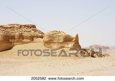 Sandstone Formations Resulting From Wind Erosion In Wadi Al-Hitan (Whale Valley), El Fayoum, Egypt View Large Photo Image Stock Image - Sandstone Formations Resulting From Wind Erosion In Wadi Al-Hitan (Whale Valley), El Fayoum, Egypt. Fotosearch