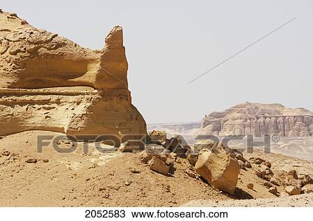 Sandstone Formations Resulting From Wind Erosion In Wadi Al-Hitan (Whale Valley), El Fayoum, Egypt View Large Photo Image Stock Image - Sandstone Formations Resulting From Wind Erosion In Wadi Al-Hitan (Whale Valley), El Fayoum, Egypt. Fotosearch