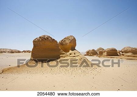 Sandstone Formations Resulting From Wind Erosion In Wadi Al-Hitan (Whale Valley), El Fayoum, Egypt View Large Photo Image Stock Image - Sandstone Formations Resulting From Wind Erosion In Wadi Al-Hitan (Whale Valley), El Fayoum, Egypt. Fotosearch