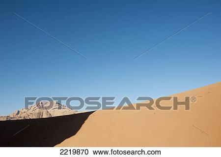 Sandy desert with mountain in background; Jordan View Large Photo Image Stock Image - Sandy desert with mountain in background; Jordan. Fotosearch