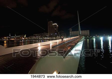 Stock Image - Santiago Calatrava's Puente de La Mujer (Women's Bridge) in Puerto Madero at night, Buenos Aires, Capital Federal, Argentina. Fotosearch