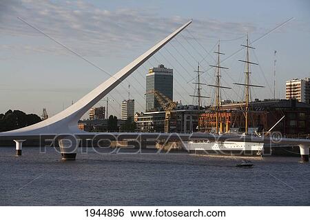 Santiago Calatrava's Puente de La Mujer (Women's Bridge) in Puerto Madero at night, Buenos Aires, Capital Federal, Argentina View Large Photo Image Stock Photograph - Santiago Calatrava's Puente de La Mujer (Women's Bridge) in Puerto Madero at night, Buenos Aires, Capital Federal, Argentina. Fotosearch