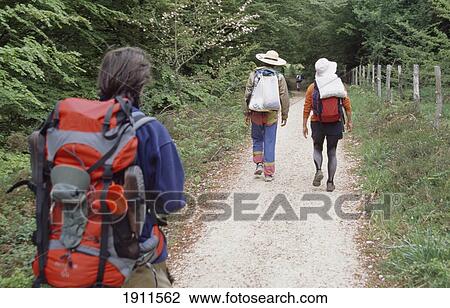 Santiago Pilgrims Walking On Path In Countryside, Pyrenees, Navarra Region, Spain View Large Photo Image Stock Image - Santiago Pilgrims Walking On Path In Countryside, Pyrenees, Navarra Region, Spain. Fotosearch