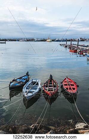 Stock Photo - Sanxenxo pier, with some small boats on the water; Galicia, Spain. Fotosearch