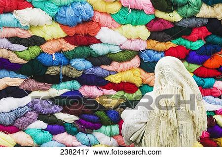 Stock Photo - Saquisili market, an indian market with colourful yarn for sale; Saquisili, Ecuador. Fotosearch