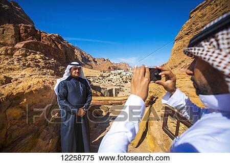 Saudi tourists taking photographs near Duba; Saudi Arabia View Large Photo Image Stock Photography - Saudi tourists taking photographs near Duba; Saudi Arabia. Fotosearch