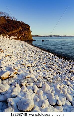 Stock Photo - Saundersfoot beach in winter; Pembrokeshire, Wales. Fotosearch