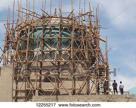 Stock Photo - Scaffolding around dome of Pakhlavan Mahmoud Mausoleum, Ichan Kala Old City, Kizilkum desert; Khiva, Khwarezm region, Uzbekistan. Fotosearch