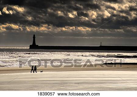 Stock Photo - Scenic View Of Sandy Beach With Lighthouse And Groyne; Sunderland, Tyne And Wear, England, Uk. Fotosearch
