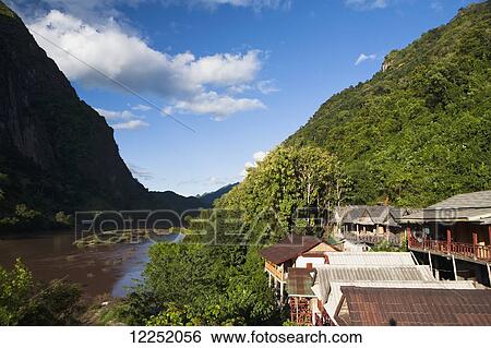 Stock Photograph - Scenic views through the Northern Laos town of Nong Khiaw, along the Ou River; Nong Khiaw, Laos. Fotosearch