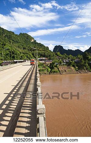Scenic views through the Northern Laos town of Nong Khiaw, along the Ou River; Nong Khiaw, Laos View Large Photo Image Stock Photography - Scenic views through the Northern Laos town of Nong Khiaw, along the Ou River; Nong Khiaw, Laos. Fotosearch
