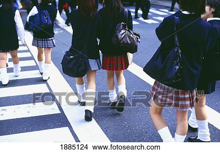 Picture - School Girls In Uniforms Walking Across Cross Walk. Fotosearch