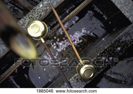 Stock Photograph - Scoops And Water At A Shinto Shrine. Fotosearch