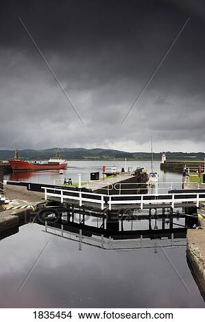 Picture - Scotland; Waterfront With Freighter In Background. Fotosearch