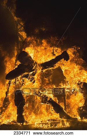Stock Image - Sculpture Burning During Fallas Festival; Valencia, Spain. Fotosearch