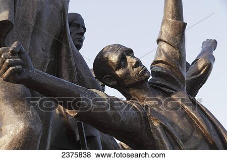 Sculpture dedicated to the resistance struggle carried out within the camp by Fritz Cremer of the memorial built during the German Democratic Republic on the south slope of the Ettersberg, Buchenwald Concentration Camp, Germany View Large Photo Image Stock Photo - Sculpture dedicated to the resistance struggle carried out within the camp by Fritz Cremer of the memorial built during the German Democratic Republic on the south slope of the Ettersberg, Buchenwald Concentration Camp, Germany. Fotosearch
