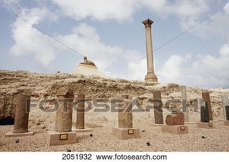 Sculpture Display And Column Of Red Granite 30M Tall, Erected In 298 Ad In Honour Of The Emperor Diocletian On The Acropolis Of Alexandria. It Was Wrongly Named PompeyÆS Pillar By Travellers During The Middle Ages, Alexandria, Al Iskandar View Large Photo Image Stock Image - Sculpture Display And Column Of Red Granite 30M Tall, Erected In 298 Ad In Honour Of The Emperor Diocletian On The Acropolis Of Alexandria. It Was Wrongly Named PompeyÆS Pillar By Travellers During The Middle Ages, Alexandria, Al Iskandar. Fotosearch