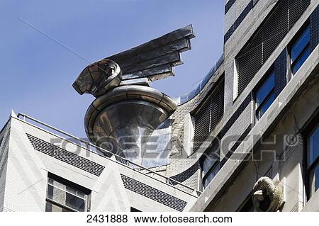 Sculpture modeled after Chrysler automobile radiator caps decorate the lower setbacks of the Chrysler Building, New York City, New York, United States View Large Photo Image Stock Photo - Sculpture modeled after Chrysler automobile radiator caps decorate the lower setbacks of the Chrysler Building, New York City, New York, United States. Fotosearch