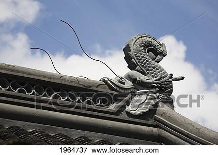 Sculpture Of A Dragonfish Eating The Roof Of A Building; Portland Oregon United States Of America View Large Photo Image Stock Photo - Sculpture Of A Dragonfish Eating The Roof Of A Building; Portland Oregon United States Of America. Fotosearch