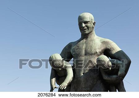 Sculpture Of A Father Holding Two Children In Frogner Park Vigeland Sculpture Park; Oslo Norway View Large Photo Image Picture - Sculpture Of A Father Holding Two Children In Frogner Park Vigeland Sculpture Park; Oslo Norway. Fotosearch