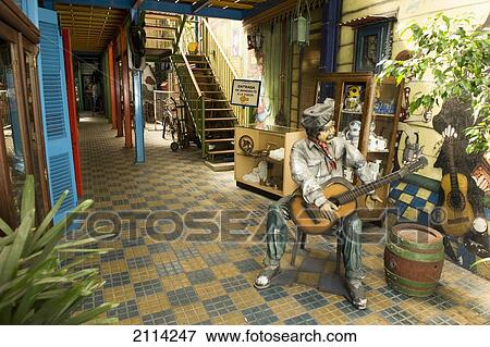 Stock Photo - Sculpture Of A Man Playing A Guitar In The Lobby Of A Building; Buenos Aires Argentina. Fotosearch