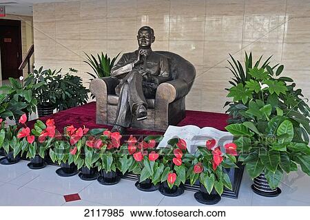 Stock Photography - Sculpture Of A Man Sitting In A Chair At The Opera House; Beijing China. Fotosearch