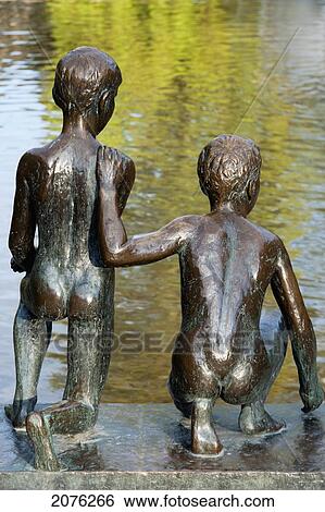 Sculpture Of Two Boys On The Water's Edge In Spikersuppa Park; Oslo Norway View Large Photo Image Stock Photograph - Sculpture Of Two Boys On The Water's Edge In Spikersuppa Park; Oslo Norway. Fotosearch