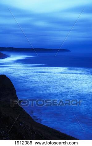 Sea At Dusk, Whitby, North Yorkshire, Uk View Large Photo Image Stock Photograph - Sea At Dusk, Whitby, North Yorkshire, Uk. Fotosearch