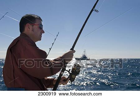Sea fishing onboard the Islamorada Lady II sportfishing vessel, Florida Keys; Florida, United States of America View Large Photo Image Stock Photo - Sea fishing onboard the Islamorada Lady II sportfishing vessel, Florida Keys; Florida, United States of America. Fotosearch