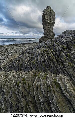 Sea stacks rise above the shoreline along the Strandir Coast in the West Fjords; Iceland View Large Photo Image Picture - Sea stacks rise above the shoreline along the Strandir Coast in the West Fjords; Iceland. Fotosearch