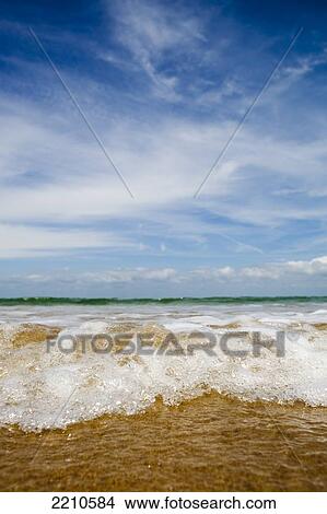 Sea washing in onto sandy beach View Large Photo Image Picture - Sea washing in onto sandy beach. Fotosearch