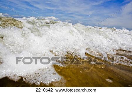 Sea washing in onto sandy beach View Large Photo Image Stock Image - Sea washing in onto sandy beach. Fotosearch