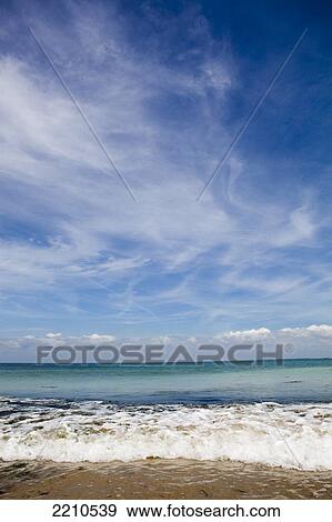 Sea washing in onto sandy beach View Large Photo Image Stock Photo - Sea washing in onto sandy beach. Fotosearch