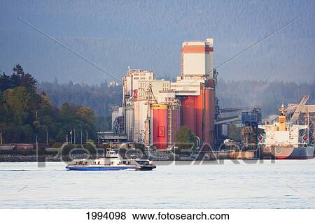 Stock Photo - Seabus In Burrard Inlet And Grain Elevators, North Vancouver, British Columbia, Canada. Fotosearch