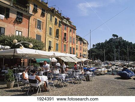 Stock Image - Seafront Cafe In The Harbour. Fotosearch