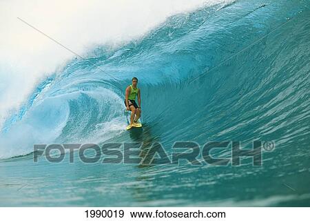 Stock Photo - Sean Briley Surfs Standing On Board, Big Wave Curling. Fotosearch